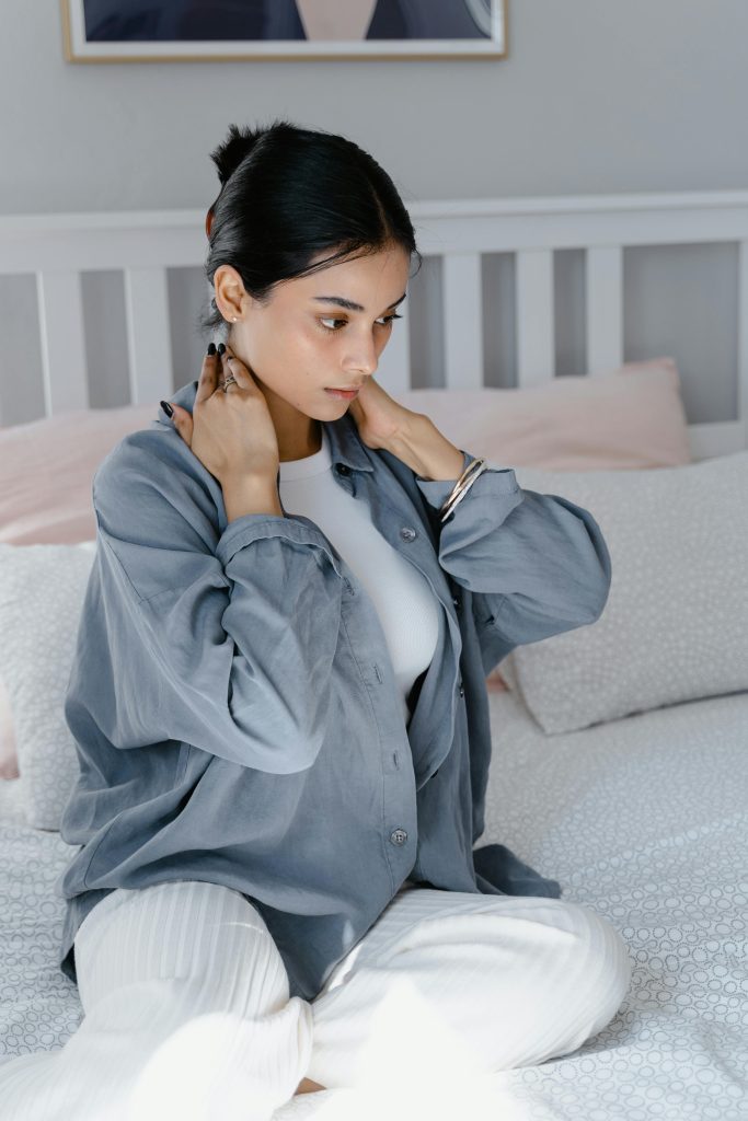 A Woman assaging Her Neck