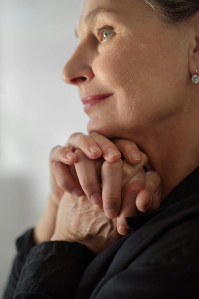Woman with Hands Clasped