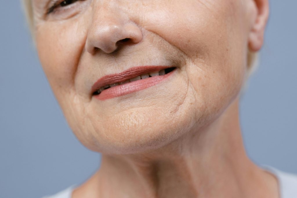 pexels-photo-8727481-8727481 Detailed close-up of an elderly woman's lips and skin, showcasing natural wrinkles.